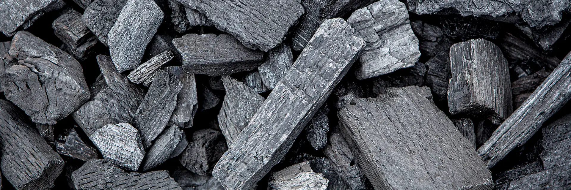 Close-up of large pieces of Big Green Egg natural lump charcoal