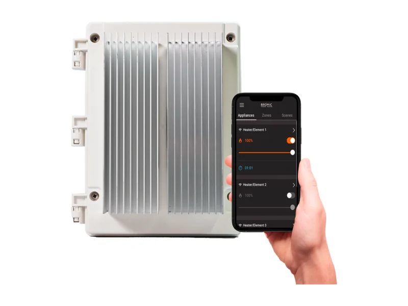 Bromic Affinity Dimmer controller in its white weatherproof housing with a heat sink, beside a phone dimming heaters in the Bromic Smart-Heat app