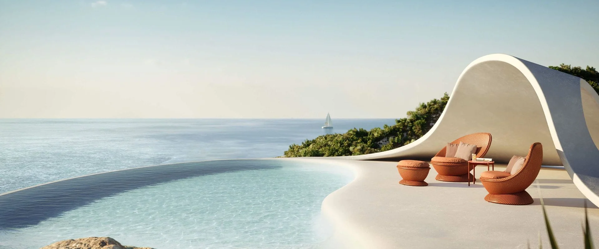 Dedon Papyon lounge chairs in terracotta weave beside a curved infinity pool overlooking the sea