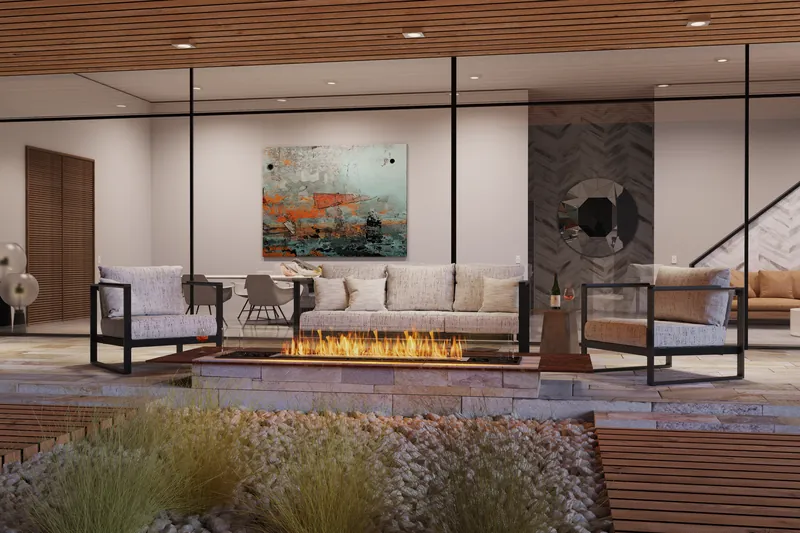 EcoSmart Fire Flex bench fireplace burning along a low bench in a lounge with a white sofa and a staircase