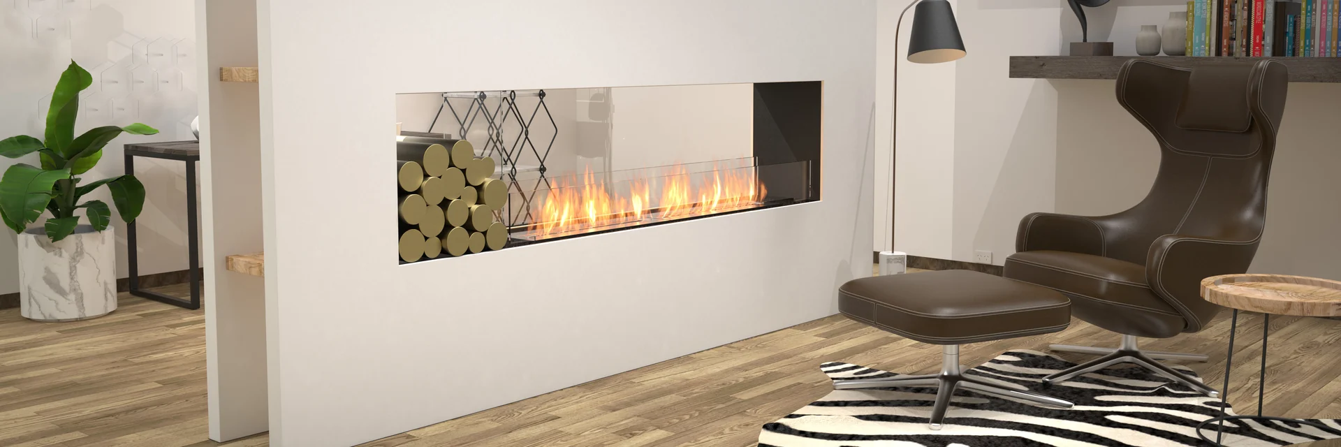 EcoSmart Fire Flex double-sided fireplace burning in a white wall beside a niche of stacked logs, with a lounge chair and a zebra rug