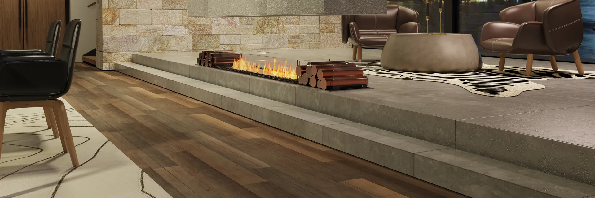 EcoSmart Fire Flex island fireplace burning on a low stone plinth in a lounge with a city view at night