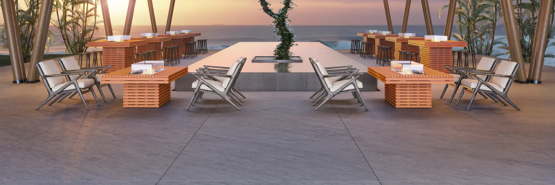 EcoSmart Gin 90 Chat fire tables in teak with chairs under a timber pavilion built around a tree, at sunset