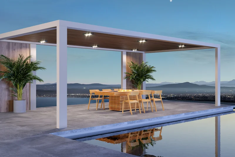 EcoSmart Gin 90 Dining fire table with chairs under a white pergola, with a bay at dusk