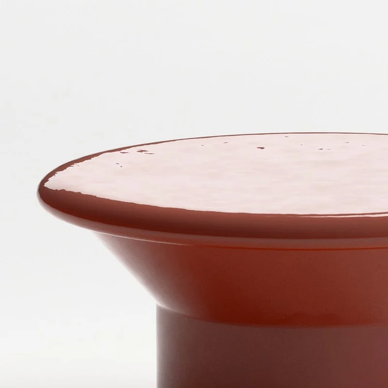 Close view of Ethimo Tama glazed ceramic coffee tables in red and dark green