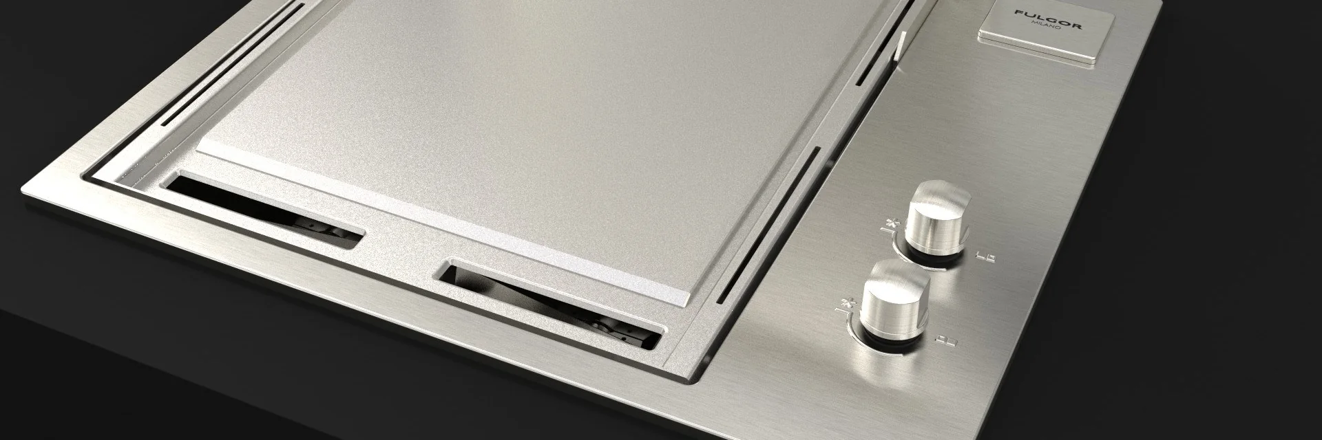 Fulgor Milano FOBQ 601 TY G X gas barbecue with a stainless steel teppanyaki plate, built flush into a dark worktop with its lid raised