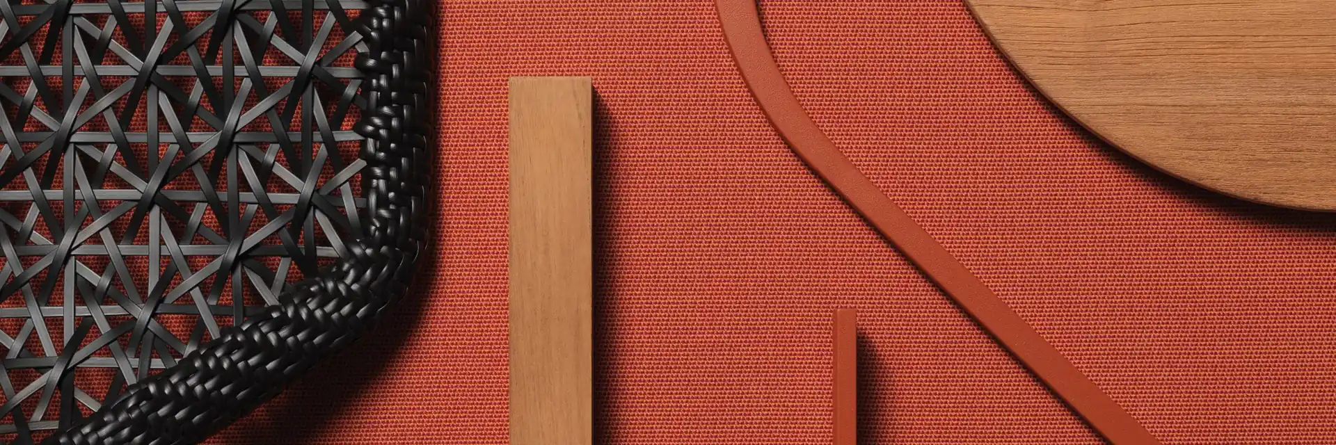 Flat lay of Kettal Maia materials: woven mesh, teak, terracotta-coloured panels and perforated samples