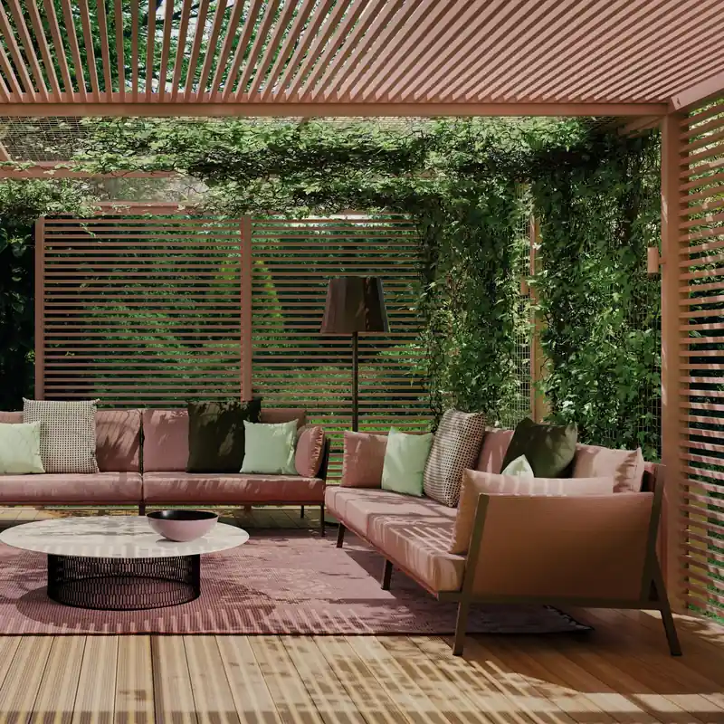 Kettal Vieques sofas with pink cushions and a rocking armchair under a slatted pergola covered with climbing plants