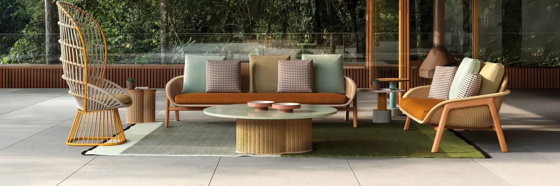 Kettal Vimini sofa, armchair and high-back chair around a low table under a timber-ceilinged canopy, with tropical trees behind