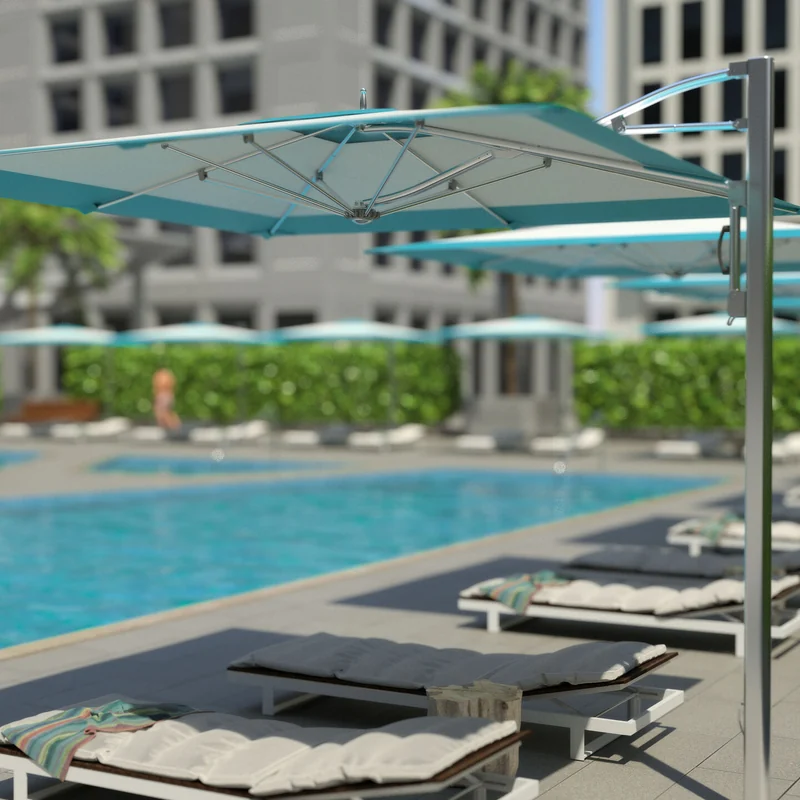 Tuuci Ocean Master M1 Classic Cantilever parasols with turquoise-trimmed canopies on polished side masts shading sun loungers along a swimming pool