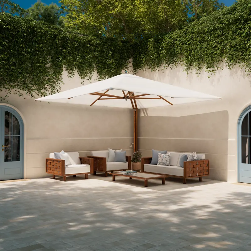 Tuuci Ocean Master MAX Shade Pod cantilever parasol with a single white canopy and wood-finish frame shading a sofa and armchairs in a walled courtyard with arched doors and climbing greenery