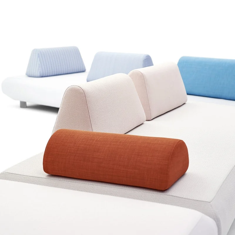 Varaschin Bento modular seating on a white platform with soft backrest cushions in pale blue, turquoise and rust, on a white background