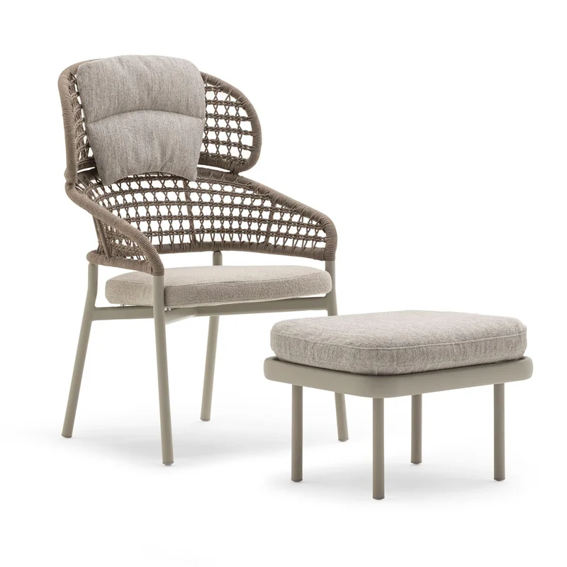 Varaschin Plinto high-back armchair in woven rope with a pale cushion and its matching footstool, on a white background
